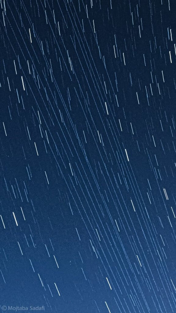 photo of night sky with stars being like lines, because of it being a long exposure photo and being taken over 12 seconds and the planet rotated on its axes in that time